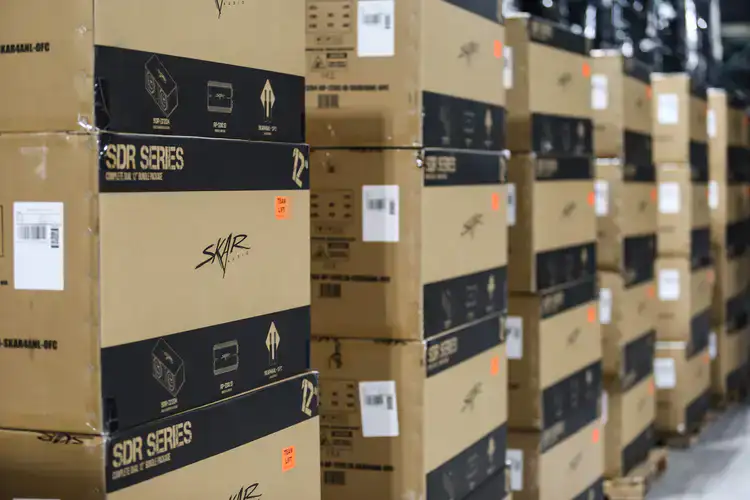 Stacks of boxes with Skar Audio products