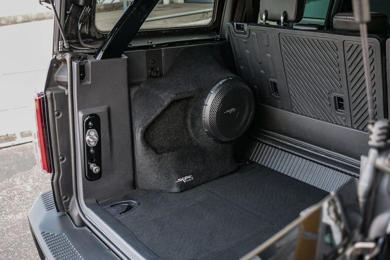Skar Audio L-VS-1X10FORDBRO-2021-UP enclosure installation example — view 1